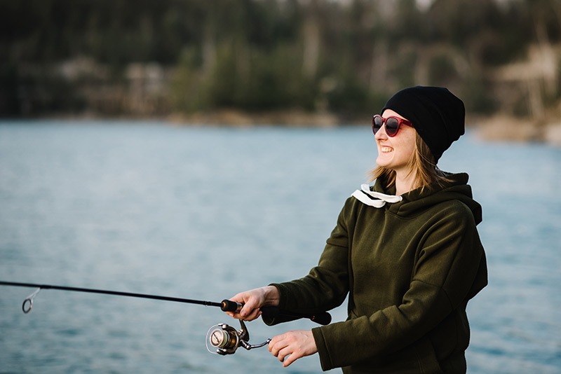 woman fishing on a lake